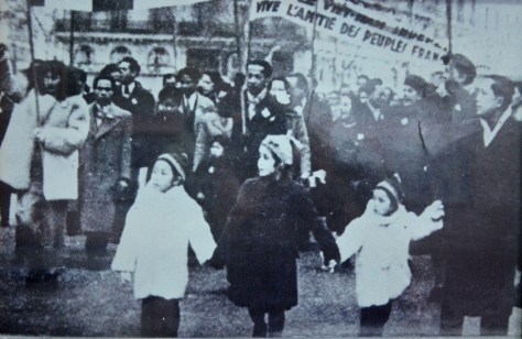 People in the city of Paris rally urging for peace in Indochina.