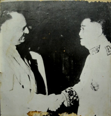 King Savangvong at a rally with US imperialist.