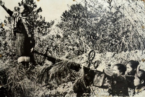 The women milita pack district of Xieng Khouang with 12.8mm machine gun in the KuKiet operation August 1969